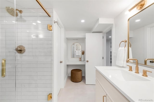 full bathroom featuring vanity, recessed lighting, and a stall shower
