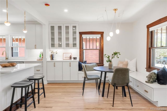 dining space with light wood-style floors, recessed lighting, and breakfast area