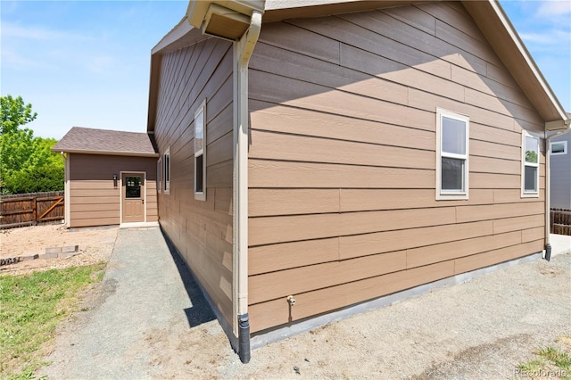 view of side of property with fence