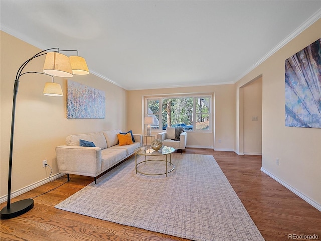 4228 Scenic Village Dr, Evergreen, CO 80439 - living area featuring crown molding, wood finished floors, and baseboards