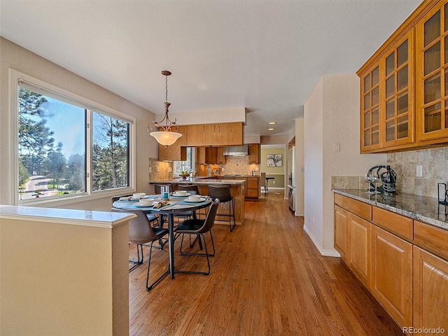 4228 Scenic Village Dr, Evergreen, CO 80439 - dining room with wood finished floors and baseboards