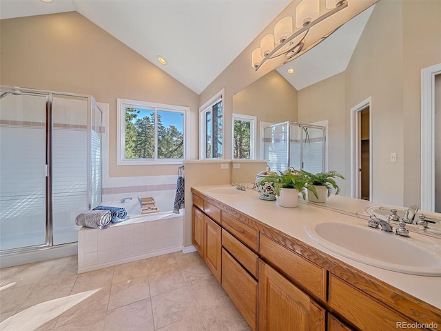 4228 Scenic Village Dr, Evergreen, CO 80439 - bathroom with a stall shower, a garden tub, double vanity, high vaulted ceiling, and tile patterned flooring