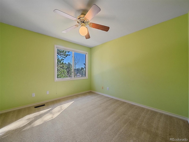4228 Scenic Village Dr, Evergreen, CO 80439 - spare room featuring baseboards, carpet flooring, and ceiling fan