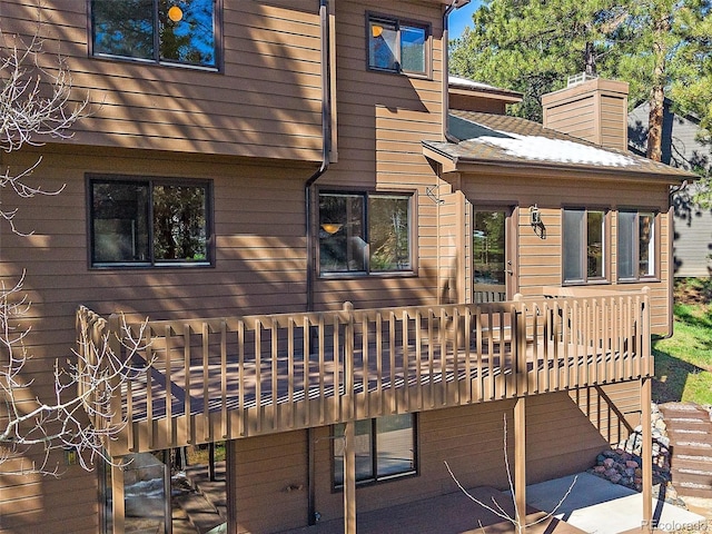 4228 Scenic Village Dr, Evergreen, CO 80439 - back of house with a deck and a patio