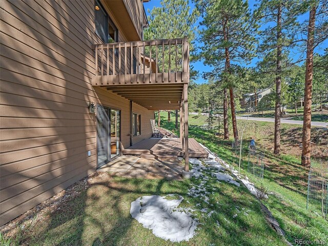 4228 Scenic Village Dr, Evergreen, CO 80439 - view of yard with a wooden deck and a patio