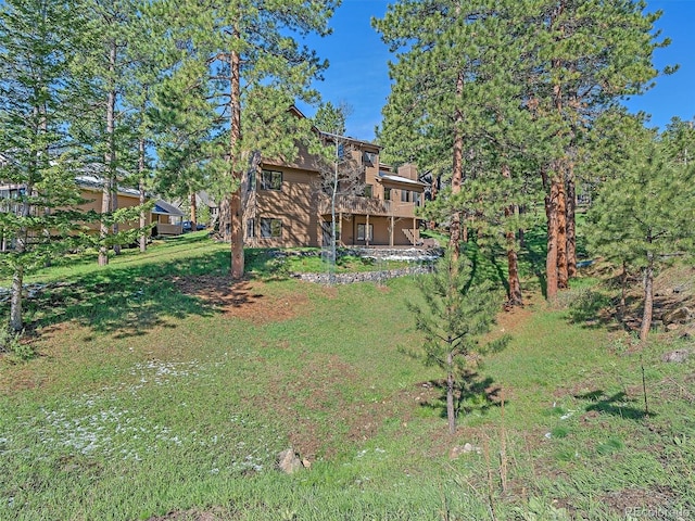 4228 Scenic Village Dr, Evergreen, CO 80439 - back of house featuring a yard and a deck