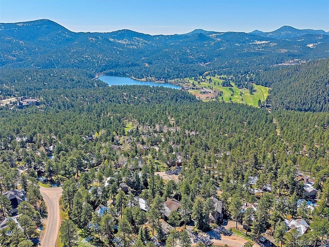 4228 Scenic Village Dr, Evergreen, CO 80439 - aerial view of property and surrounding area with a heavily wooded area and a water and mountain view
