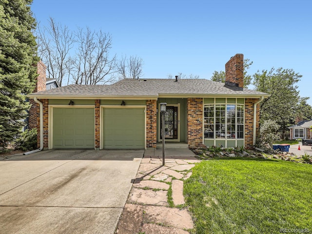 ranch-style home with a chimney, an attached garage, concrete driveway, and brick siding