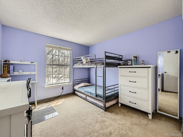 carpeted bedroom with a textured ceiling