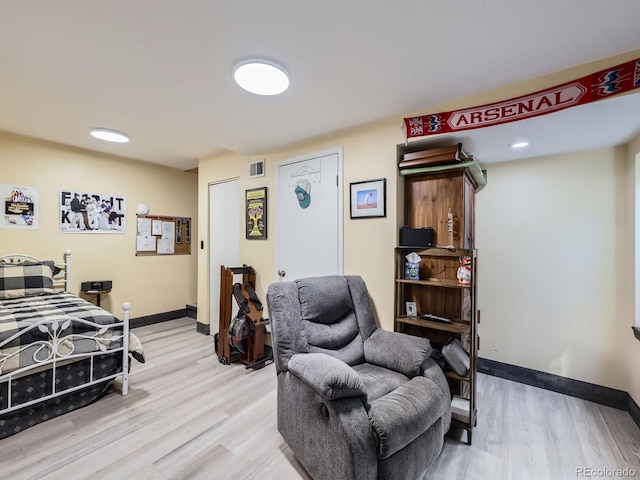 bedroom featuring baseboards and light wood-style flooring