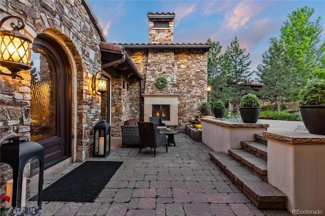 7208 Raphael Ln, Littleton, CO 80125 - view of patio featuring an outdoor living space with a fireplace