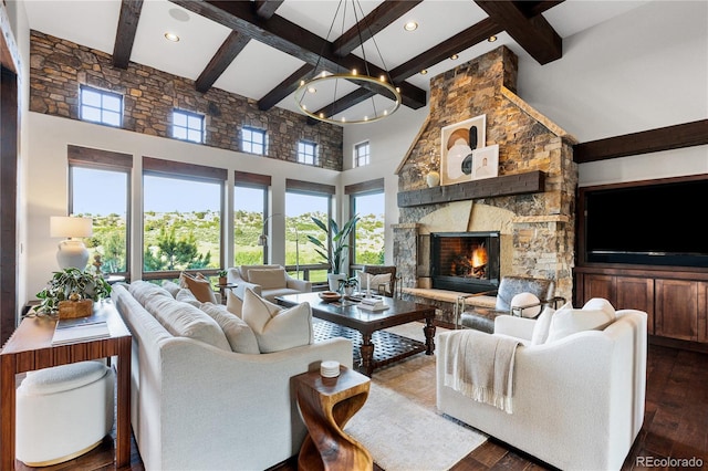 7208 Raphael Ln, Littleton, CO 80125 - living area with dark wood finished floors, beamed ceiling, healthy amount of natural light, a towering ceiling, and a fireplace