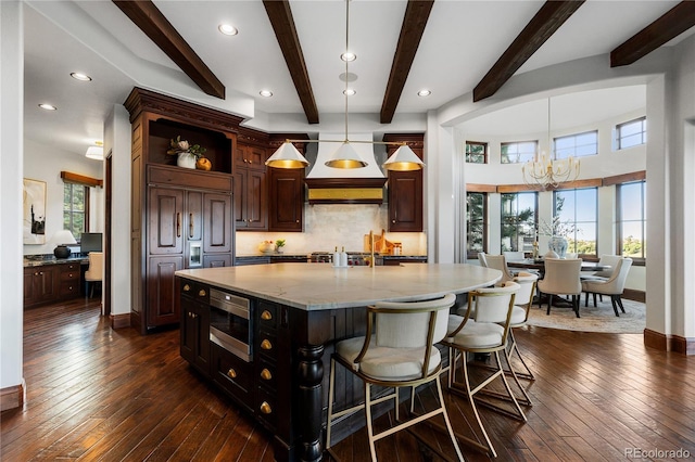 7208 Raphael Ln, Littleton, CO 80125 - kitchen with built in appliances, a chandelier, tasteful backsplash, dark wood finished floors, and plenty of natural light