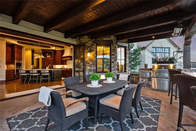 7208 Raphael Ln, Littleton, CO 80125 - view of patio / terrace with outdoor dining space and a sink