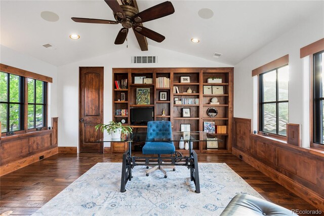 7208 Raphael Ln, Littleton, CO 80125 - office featuring plenty of natural light, vaulted ceiling, dark wood-style floors, wainscoting, and ceiling fan