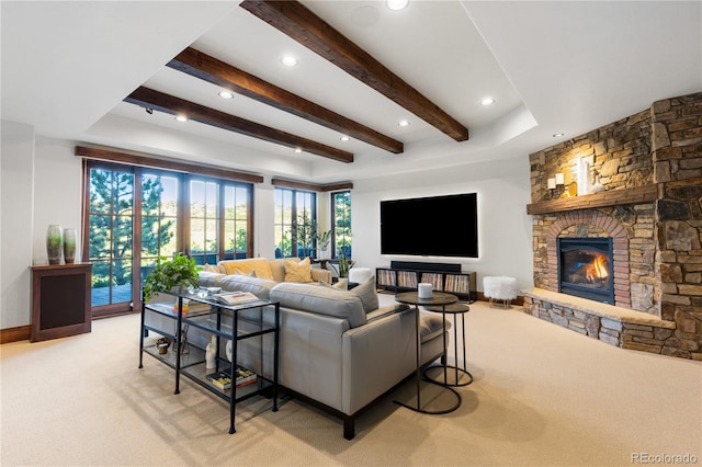 7208 Raphael Ln, Littleton, CO 80125 - living room with light colored carpet, beamed ceiling, a fireplace, recessed lighting, and baseboards