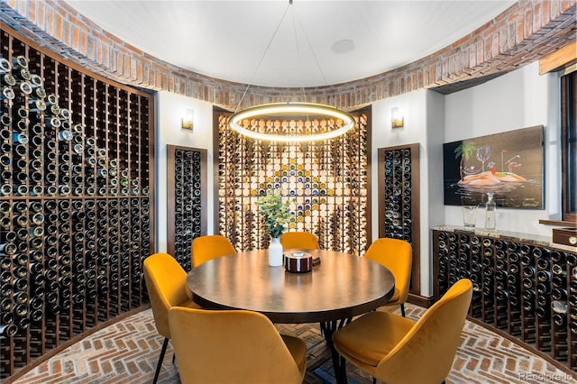 7208 Raphael Ln, Littleton, CO 80125 - wine area with brick floors and a chandelier