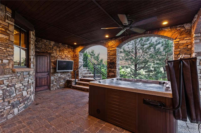 7208 Raphael Ln, Littleton, CO 80125 - view of patio / terrace featuring a hot tub, ceiling fan, and stairway