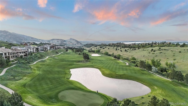 7208 Raphael Ln, Littleton, CO 80125 - surrounding community featuring golf course view and a water and mountain view