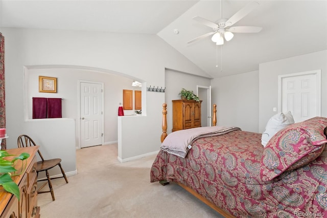 bedroom with light carpet, lofted ceiling, baseboards, arched walkways, and ceiling fan