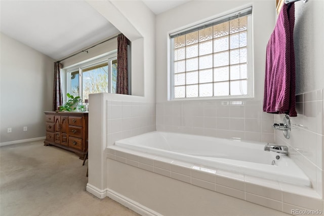 full bathroom with baseboards and a bath