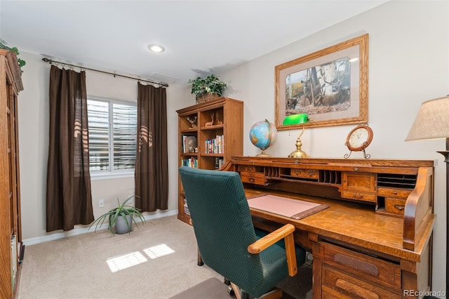 carpeted office featuring baseboards, built in desk, and recessed lighting