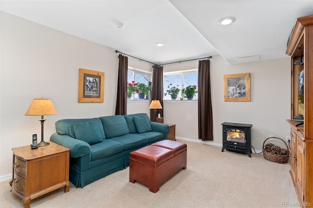 living room featuring a wood stove, light carpet, baseboards, and recessed lighting