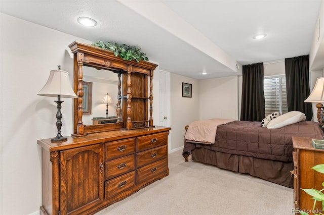 bedroom featuring light colored carpet, baseboards, and recessed lighting