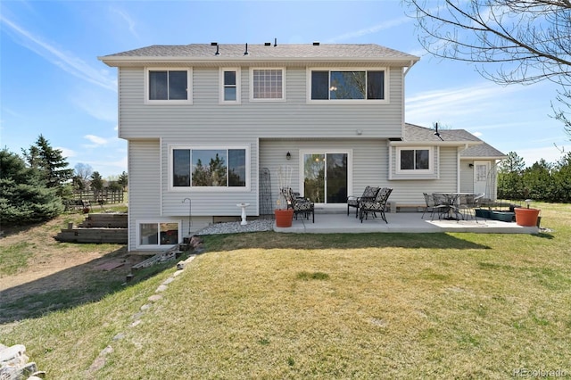 back of house with a patio and a yard