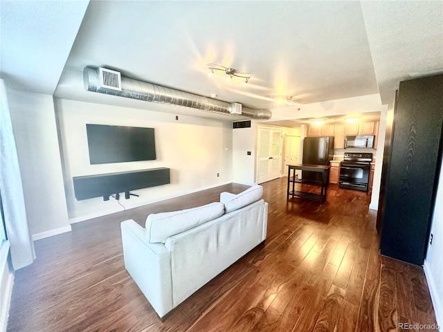 living room with dark hardwood / wood-style floors