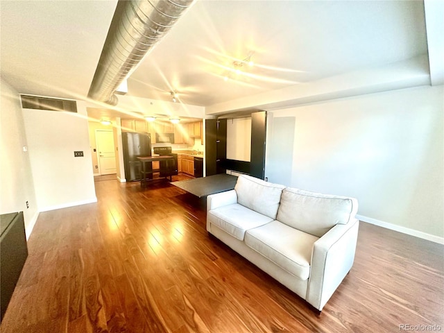 unfurnished living room featuring dark hardwood / wood-style floors