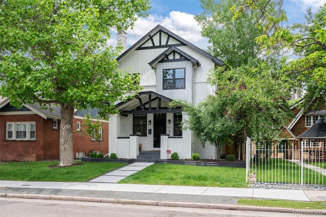 451 S Franklin St, Denver, CO 80209 - view of front facade featuring brick siding, board and batten siding, and a porch