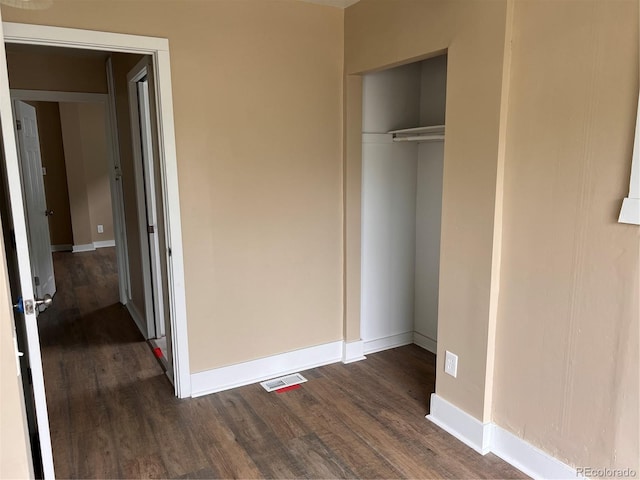 4875 Lowell Blvd, Denver, CO 80221 - unfurnished bedroom with dark wood-type flooring and a closet