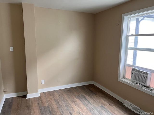 4875 Lowell Blvd, Denver, CO 80221 - spare room with wood finished floors, plenty of natural light, and cooling unit