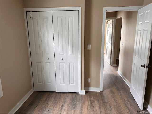 4875 Lowell Blvd, Denver, CO 80221 - unfurnished bedroom featuring dark wood finished floors and a closet