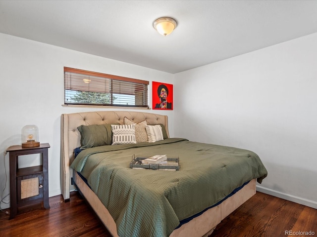 bedroom with dark wood-type flooring