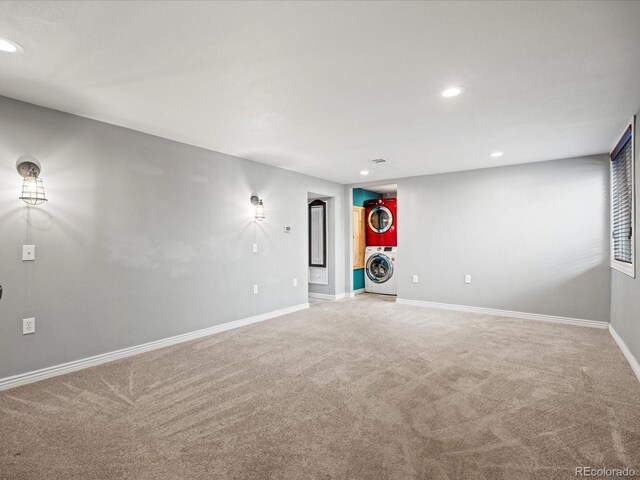 interior space with carpet flooring and stacked washer / drying machine