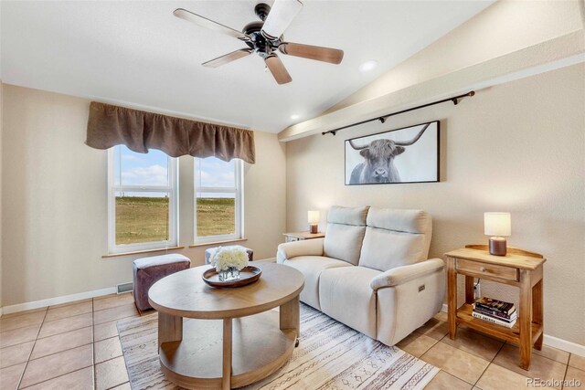 5129 S Tom Bay Rd, Bennett, CO 80102 - living area featuring lofted ceiling, baseboards, a ceiling fan, and light tile patterned floors