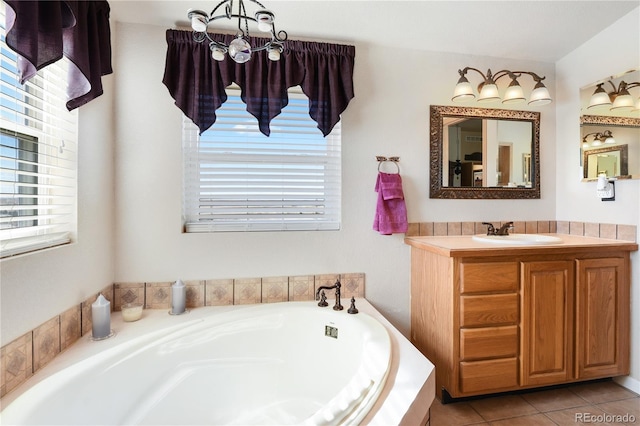 5129 S Tom Bay Rd, Bennett, CO 80102 - bathroom featuring tile patterned flooring, vanity, and a bath