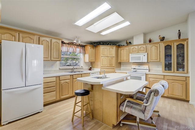 688 Tiara Rd, Lake George, CO 80827 - kitchen with white appliances, a sink, light brown cabinets, and vaulted ceiling