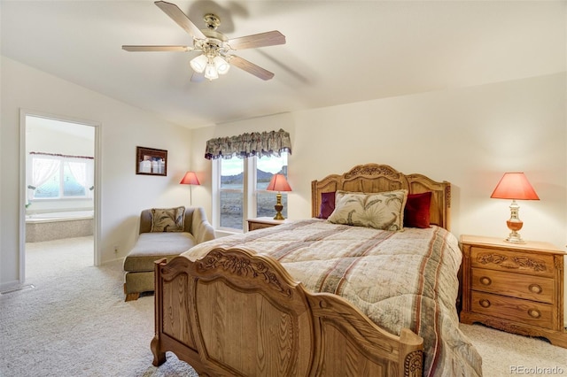 688 Tiara Rd, Lake George, CO 80827 - bedroom featuring light carpet, lofted ceiling, multiple windows, ensuite bathroom, and ceiling fan