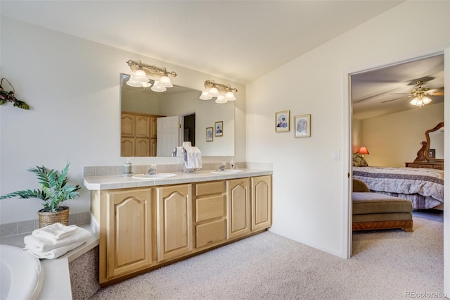 688 Tiara Rd, Lake George, CO 80827 - bathroom featuring connected bathroom, carpet floors, double vanity, and ceiling fan