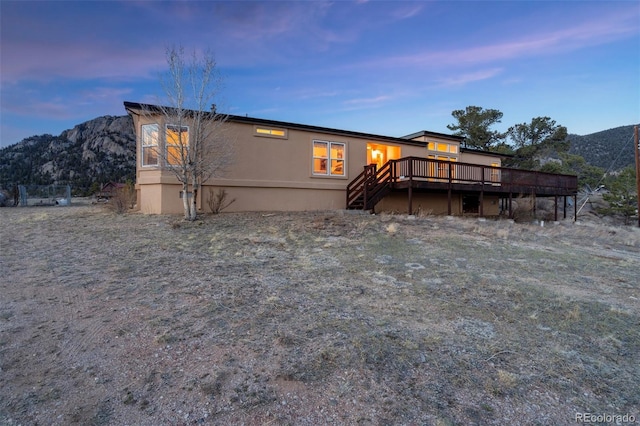 688 Tiara Rd, Lake George, CO 80827 - back of house featuring a deck with mountain view and stairs