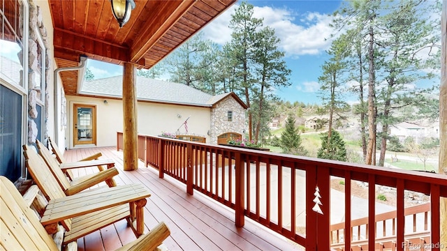 wooden deck with a residential view
