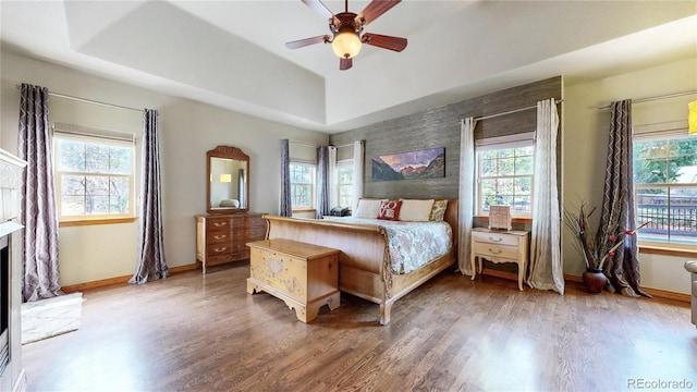 bedroom featuring multiple windows and baseboards