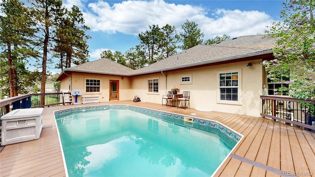 outdoor pool with a deck