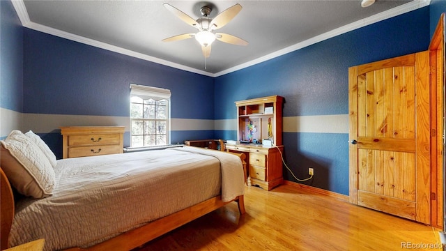 bedroom featuring light wood-style flooring, crown molding, ceiling fan, and baseboards