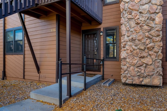 doorway to property featuring a balcony