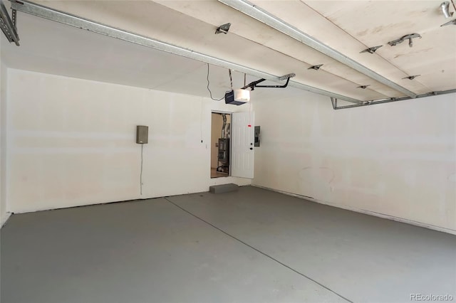 garage featuring a garage door opener and electric panel