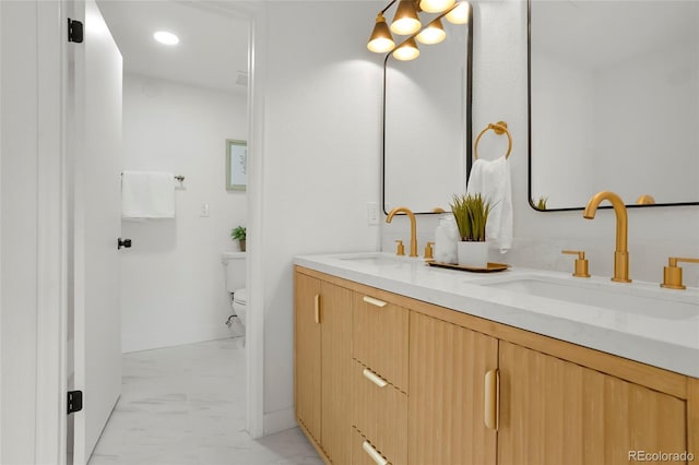 bathroom with vanity and toilet